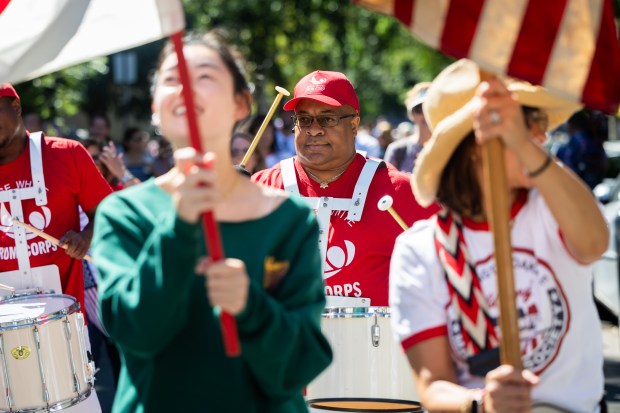 Members of the Jesse White Drum Corps perform in the WOOGMS parade in the Lakeview neighborhood of Chicago on Sept. 2, 2024. (Tess Crowley/Chicago Tribune)