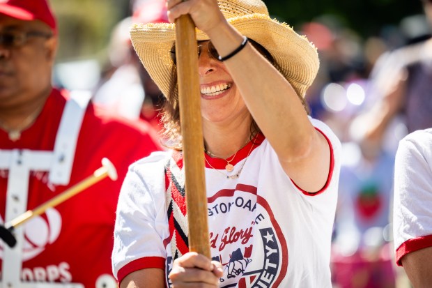 A parade participant walks in the WOOGMS parade, short for the Wellington/Oakdale Old Glory Marching Society, in the Lakeview neighborhood of Chicago on Sept. 2, 2024. (Tess Crowley/Chicago Tribune)