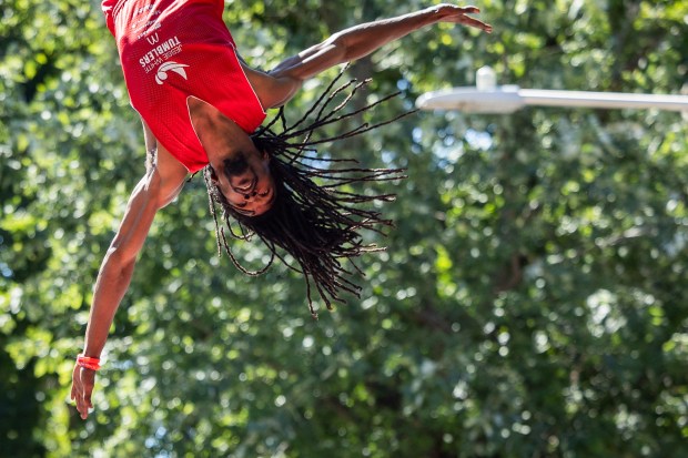 Members of the Jesse White Tumbling Team perform during the WOOGMS parade in the Lakeview neighborhood of Chicago on Sept. 2, 2024. (Tess Crowley/Chicago Tribune)