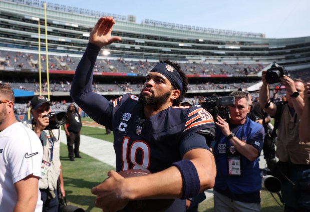 Bears quarterback Caleb Williams celebrates while coming off the field after a victory over the Titans at Soldier Field on Sept. 8, 2024. (Chris Sweda/Chicago Tribune)