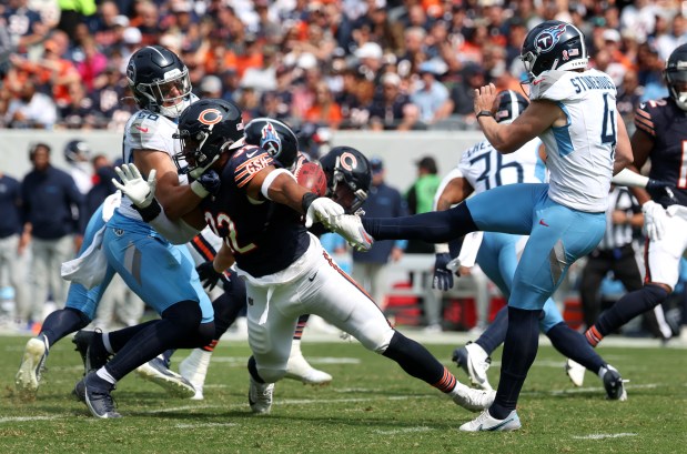 Titans punter Ryan Stonehouse has his punt blocked by Bears defensive end Daniel Hardy in the third quarter of at Soldier Field. Bears safety Jonathan Owens returned the ball for the touchdown. (Chris Sweda/Chicago Tribune)