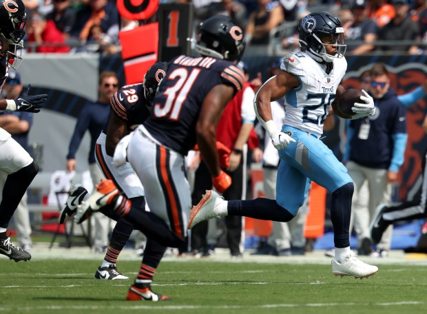 Titans running back Tony Pollard runs in for a touchdown in the first quarter against the Bears at Soldier Field on Sept. 8, 2024. (Chris Sweda/Chicago Tribune)