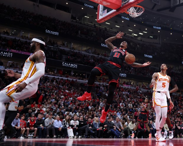 Chicago Bulls forward DeMar DeRozan (11) reacts after dunking the ball in the first half of a Play-In Tournament game against the Atlanta Hawks at the United Center in Chicago on April 17, 2024. (Chris Sweda/Chicago Tribune)