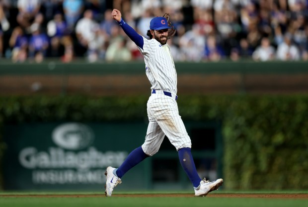 Chicago Cubs shortstop Dansby Swanson reacts after making a throw to first base following his force out at second base in the second inning of a game against the Washington Nationals at Wrigley Field in Chicago on Sept. 19, 2024. (Chris Sweda/Chicago Tribune)