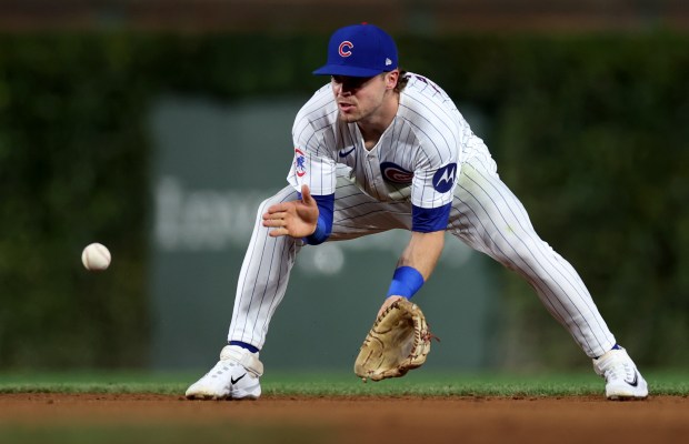 Chicago Cubs second baseman Nico Hoerner (2) fields a ground ball in the second inning of a game against the Washington Nationals at Wrigley Field in Chicago on Sept. 19, 2024. (Chris Sweda/Chicago Tribune)