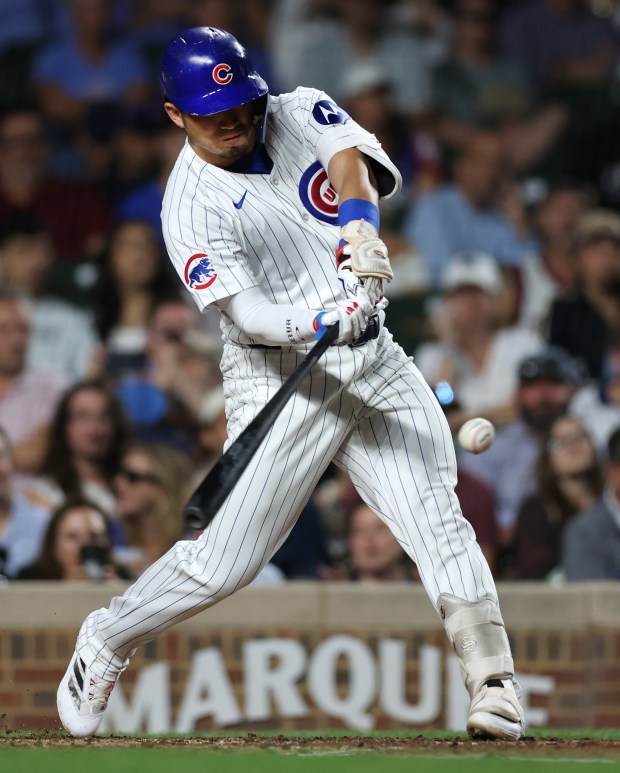 Chicago Cubs right fielder Seiya Suzuki hits a 2-run home run in the third inning of a game against the Washington Nationals at Wrigley Field in Chicago on Sept. 19, 2024. (Chris Sweda/Chicago Tribune)