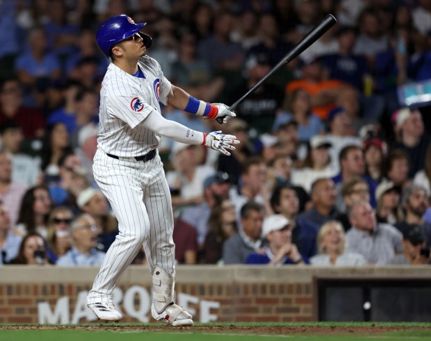 Chicago Cubs right fielder Seiya Suzuki watches the flight of his 2-run home run in the third inning of a game against the Washington Nationals at Wrigley Field in Chicago on Sept. 19, 2024. (Chris Sweda/Chicago Tribune)