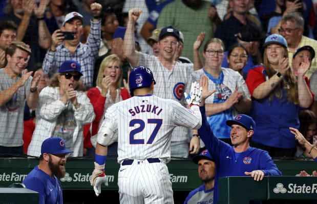 Cubs manager Craig Counsell, right, congratulates right fielder Seiya Suzuki after Suzuki hit a two-run home run in the third inning against the Nationals on Sept. 19, 2024, at Wrigley Field. (Chris Sweda/Chicago Tribune)