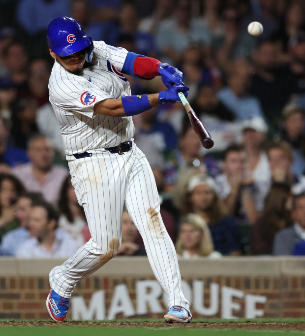 Chicago Cubs third baseman Isaac Paredes (17) drives in a run on a sacrifice fly in the fifth inning of a game against the Washington Nationals at Wrigley Field in Chicago on Sept. 19, 2024. (Chris Sweda/Chicago Tribune)