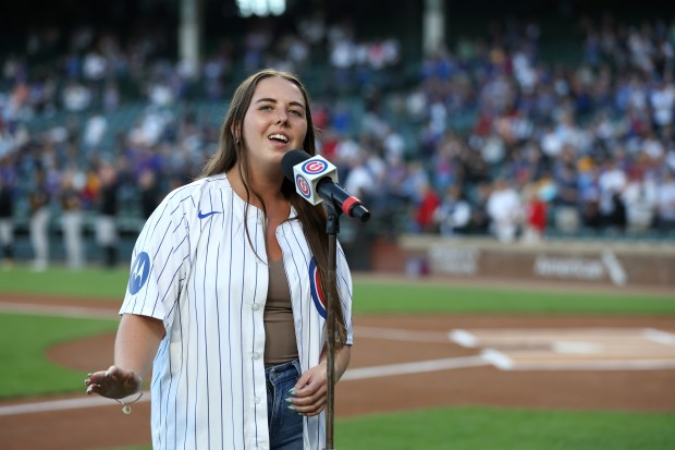 Ali Berke (cq) sings the national anthem before the start of a game between the Chicago Cubs and the Pittsburgh Pirates at Wrigley Field in Chicago on Sept. 3, 2024. (Chris Sweda/Chicago Tribune)