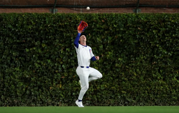 Chicago Cubs center fielder Pete Crow-Armstrong (52) catches a deep fly ball that went for a run-scoring sacrifice fly for Pittsburgh Pirates designated hitter Andrew McCutchen in the third inning of a game at Wrigley Field in Chicago on Sept. 3, 2024. (Chris Sweda/Chicago Tribune)