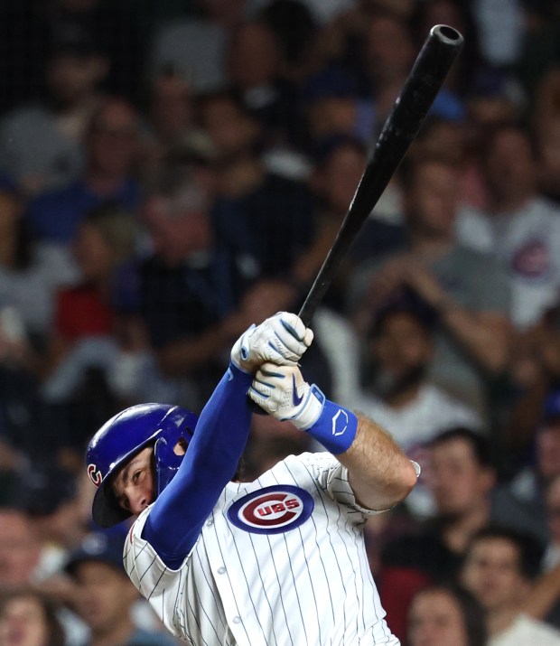 Chicago Cubs shortstop Dansby Swanson (7) drives in a run on a double in the fifth inning of a game against the Pittsburgh Pirates at Wrigley Field in Chicago on Sept. 4, 2024. (Chris Sweda/Chicago Tribune)