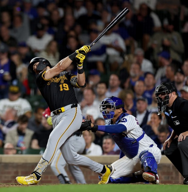 Pittsburgh Pirates third baseman Jared Triolo hits a 3-run home run off of Chicago Cubs relief pitcher Tyson Miller in the seventh inning of a game at Wrigley Field in Chicago on Sept. 3, 2024. (Chris Sweda/Chicago Tribune)