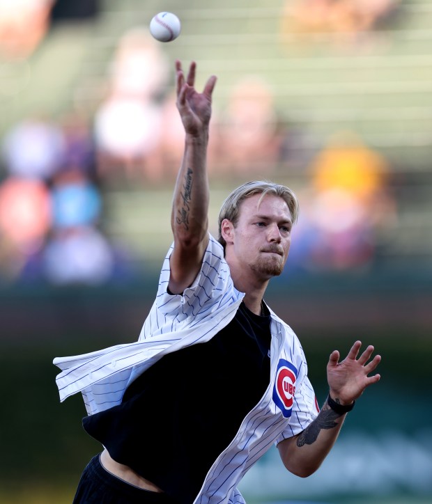 Chicago Fire goalkeeper Chris Brady throws out a ceremonial first pitch before a game between the Chicago Cubs and the Pittsburgh Pirates at Wrigley Field in Chicago on Sept. 3, 2024. (Chris Sweda/Chicago Tribune)