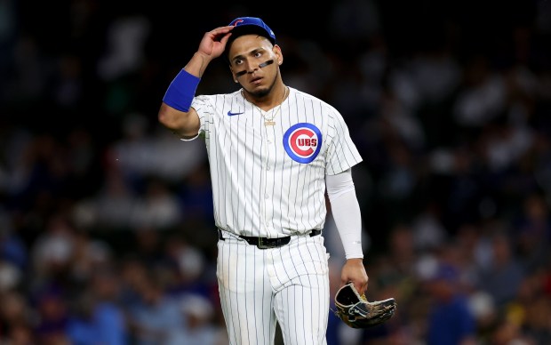 Chicago Cubs third baseman Isaac Paredes walks to his position after lining up to end the fifth inning of a game against the Pittsburgh Pirates at Wrigley Field in Chicago on Sept. 3, 2024. (Chris Sweda/Chicago Tribune)