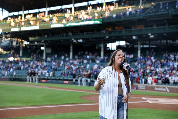 Ali Berke sings the national anthem before the start of a game between the Chicago Cubs and the Pittsburgh Pirates at Wrigley Field in Chicago on Sept. 3, 2024. (Chris Sweda/Chicago Tribune)