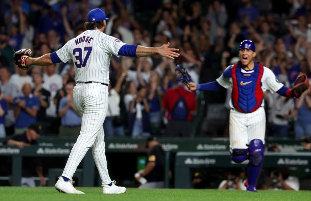 Chicago Cubs pitcher Porter Hodge (37) and catcher Miguel Amaya (9) react after closing out the Pittsburgh Pirates in the ninth inning of a game at Wrigley Field in Chicago on Sept. 4, 2024. Hodge, Nate Pearson, and starter Shota Imanaga combined to no-hit the Pirates. (Chris Sweda/Chicago Tribune)