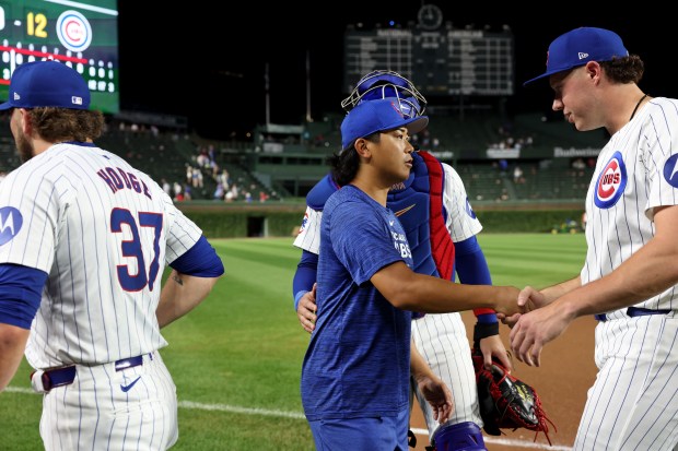 Chicago Cubs pitchers Porter Hodge (37), Shota Imanaga (center), and Nate Pearson (right), celebrate with catcher Miguel Amaya, after the group combined to no-hit the Pittsburgh Pirates at Wrigley Field in Chicago on Sept. 4, 2024. (Chris Sweda/Chicago Tribune)