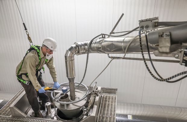 Pumper Mitch Bauman works to load chocolate into a truck at Ferrero's Bloomington factory in May before it is transported to another facility. (Clay Jackson/The Pantagraph)