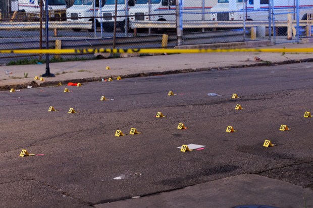 Bullet casings sit at the scene where a 47-year-old man and a 39-year-old man were shot on the 2400 block of West Monroe Street early Sunday July 7, 2024 in Chicago. (Armando L. Sanchez/Chicago Tribune)