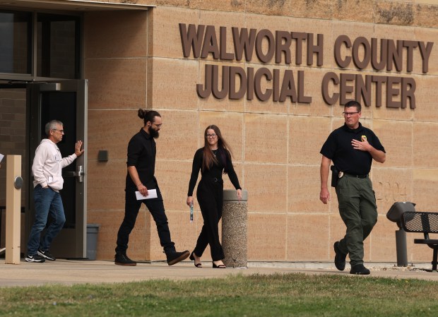 Family members of Kara Welsh are escorted out of the Walworth County Judicial Center by law enforcement following a hearing for defendant Chad T. Richards on Sept. 6, 2024, in Elkhorn, Wisconsin. Welsh was murdered last Friday night near the University of Wisconsin Whitewater campus. (Stacey Wescott/Chicago Tribune)