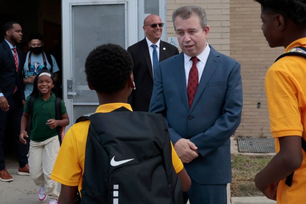 Chicago Public Schools CEO Pedro Martinez greets students at the first day back to school at Chalmers Elementary Specialty School on Aug. 26, 2024. (Antonio Perez/Chicago Tribune)