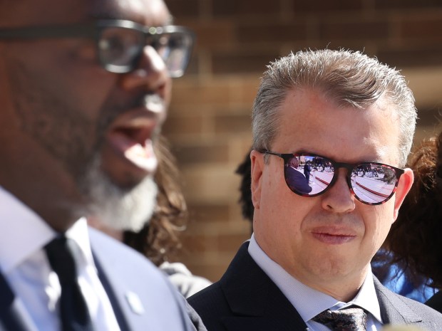 Chicago Public Schools CEO Pedro Martinez, right, watches Mayor Brandon Johnson speak during a ceremony at Uplift Community High School, Sept. 3, 2024. (Antonio Perez/Chicago Tribune)