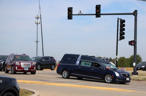 The hearse carrying the body of Kara Welsh arrives at St. Mary Immaculate Church on Sept. 13, 2024, in Plainfield. Welsh was a student and gymnast at University of Wisconsin Whitewater. A fellow student has been charged with her shooting death. (Stacey Wescott/Chicago Tribune)