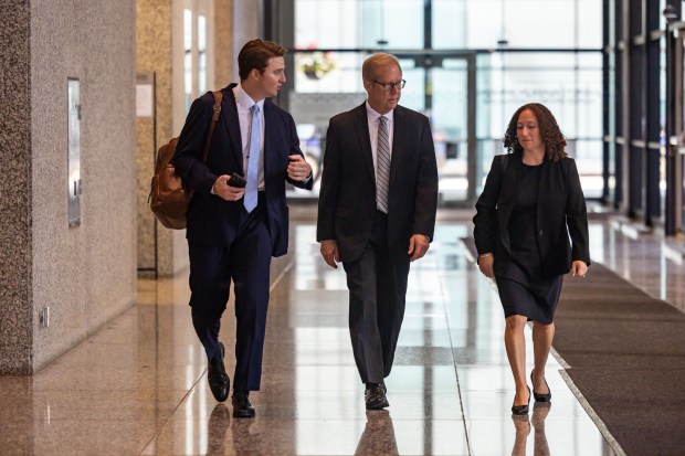 Former AT&T Illinois lobbyist Stephen Selcke, center, leaves the Dirksen U.S. Courthouse after testifying under an immunity deal in the bribery trial for former AT&T Illinois president Paul La Schiazza, Sept. 12, 2024. (Tess Crowley/Chicago Tribune)