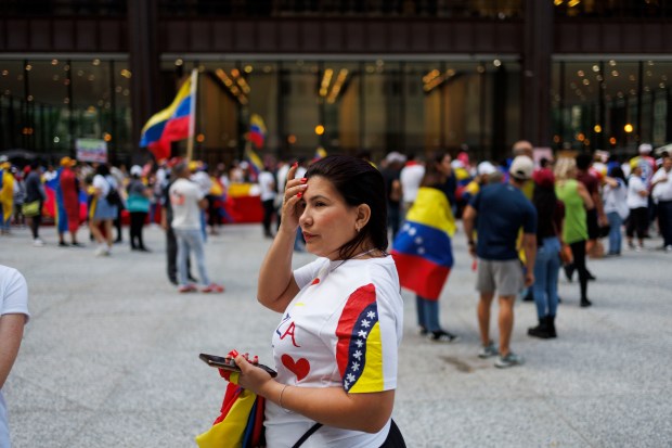 Betzabeth Bracho, 34, attends a rally in Daley Plaza to protest Venezuelan President Nicolás Maduro after authorities declared Maduro the victor against oppositional presidential candidate Edmundo González on Aug. 6, 2024, in Chicago. (Armando L. Sanchez/Chicago Tribune)