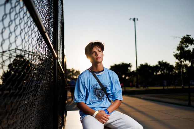 Yoel Guerra, 16, poses for a portrait before playing softball in La Villita Park on Aug. 29, 2024, in Chicago. The 16-year-old from Venezuela said he likes Little Village Summer Softball. (Armando L. Sanchez/Chicago Tribune)