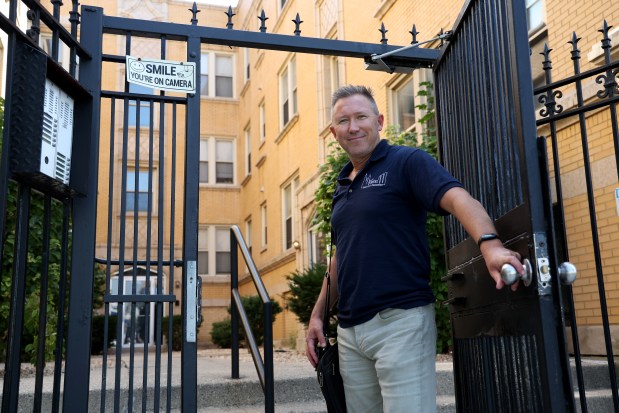 Jon Womack, managing partner at Third City Properties, which has been investing in and managing real estate, stands outside one of his properties in the 1600 block of North Central Avenue, in Chicago, on Sept. 12, 2024. (Antonio Perez/Chicago Tribune)