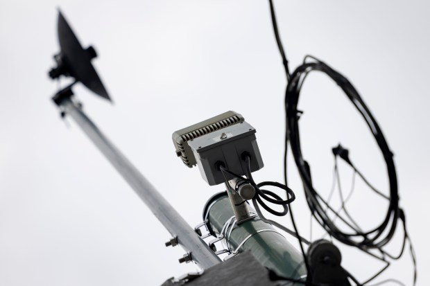 Devices on light poles that might be related to ShotSpotter technology on Monday, Sept. 23, 2024, in the Austin neighborhood. (Brian Cassella/Chicago Tribune)