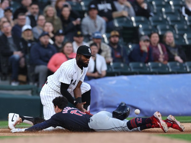 White Sox third baseman Bryan Ramos catches a late throw as Guardians outfielder Will Brennan slides for a triple in the third inning on May 10, 2024, at Guaranteed Rate Field. (Chris Sweda/Chicago Tribune)