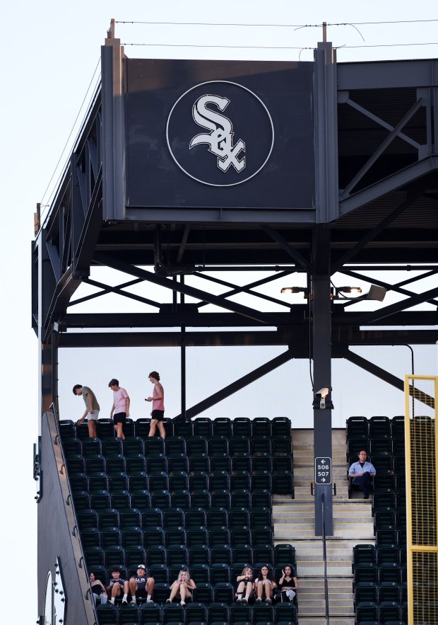 A few fans take their seats in the right field upper deck in the third inning of a game between the Chicago White Sox and the New York Mets at Guaranteed Rate Field in Chicago on Aug. 31, 2024. (Chris Sweda/Chicago Tribune)