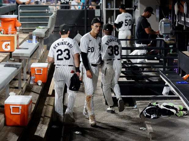 Chicago White Sox players Andrew Benintendi (23) and Miguel Vargas (20) walk through the dugout after a loss to the New York Mets at Guaranteed Rate Field in Chicago on Aug. 31, 2024. (Chris Sweda/Chicago Tribune)