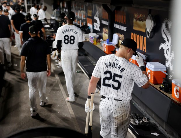 Chicago White Sox first baseman Andrew Vaughn (25) and center fielder Luis Robert Jr. (88) head from the dugout to the locker room after a loss to the New York Mets at Guaranteed Rate Field in Chicago on Aug. 31, 2024. (Chris Sweda/Chicago Tribune)