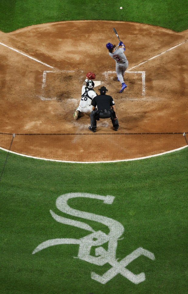 New York Mets left fielder Jesse Winker (3) connects with the ball on a single in the sixth inning of a game against the Chicago White Sox at Guaranteed Rate Field in Chicago on Aug. 31, 2024. (Chris Sweda/Chicago Tribune)