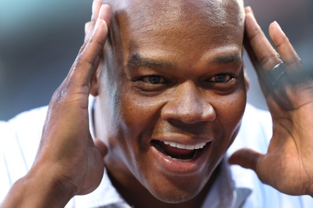 Chicago White Sox great Frank Thomas has some fun on the field before throwing out a ceremonial first pitch before a game between the Sox and the New York Mets at Guaranteed Rate Field in Chicago on Aug. 31, 2024. (Chris Sweda/Chicago Tribune)