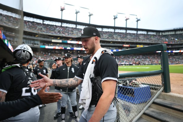 Chicago White Sox starting pitcher Garrett Crochet (45) receives high-fives from his teammates before taking on the Detroit Tigers at Comerica Park in Detroit on Sept. 27, 2024. (Chris Sweda/Chicago Tribune)