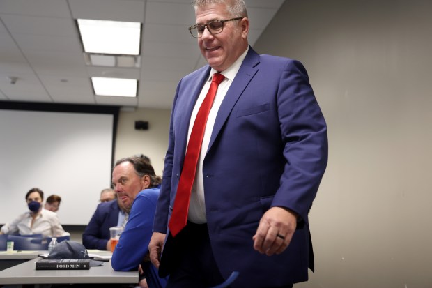 Unsuccessful 2022 Republican governor nominee Darren Bailey prepares to testify about his interactions with Dan Proft, seated just left of Bailey, and Jose Durbin during a hearing held by the State Board of Elections on on April 29, 2024, in Chicago. (Stacey Wescott/Chicago Tribune)