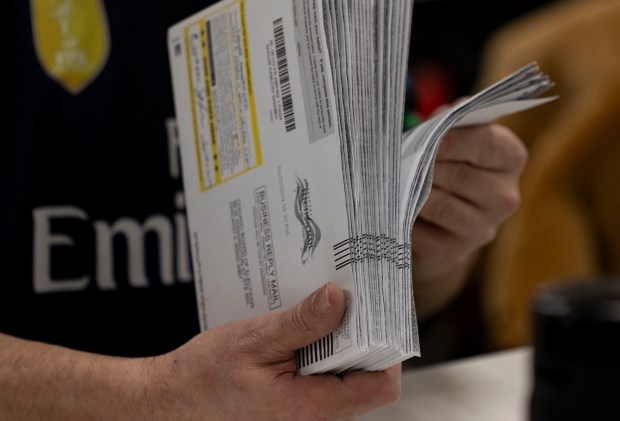 Central count election judges process primary election mail-in ballots March 24, 2024, at the Chicago Board of Elections. (Brian Cassella/Chicago Tribune)