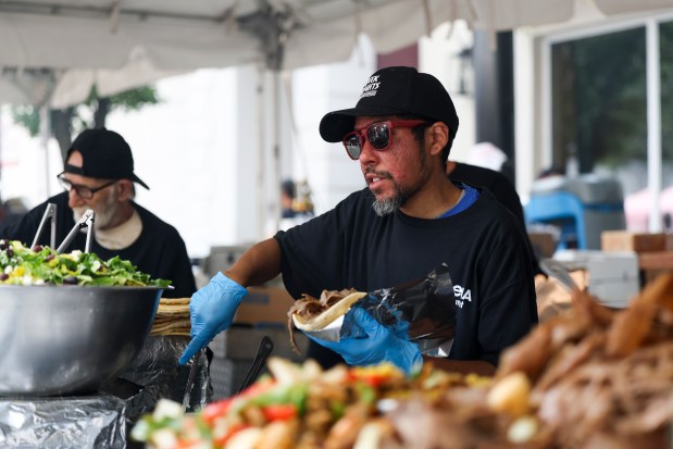 An Athena Restaurant worker prepares a gyro during Taste of Greektown in the Greektown neighborhood on Sunday, Sept. 8, 2024. (Eileen T. Meslar/Chicago Tribune)