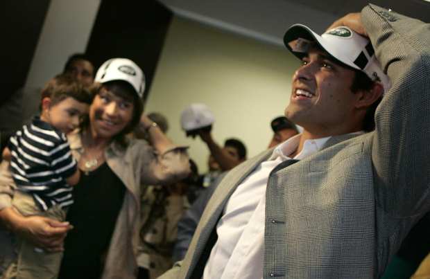 USC quarterback Mark Sanchez puts on Jets cap on April 25, 2009, after he got the word that he was drafted. (Ken Hively / L.A. Times)