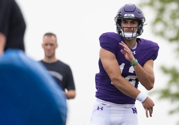 Northwestern quarterback Jack Lausch throws during practice on Aug. 9, 2023, at Hutcheson Field in Evanston. (Brian Cassella/Chicago Tribune)