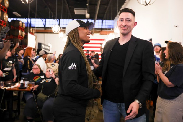 Sky coach Teresa Weatherspoon and GM Jeff Pagliocca celebrate during a WNBA draft watch party at Revolution Brewing on April 15, 2024. (Eileen T. Meslar/Chicago Tribune)