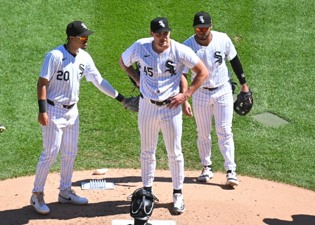 Garrett Crochet #45 of the Chicago White Sox reacts while Miguel Vargas #20 and Lenyn Sosa #50 of the Chicago White Sox show their support during the fourth inning against the New York Mets at Guaranteed Rate Field on Sept. 01, 2024 in Chicago, Illinois. The Mets defeated the White Sox 2-0. (Photo by Nuccio DiNuzzo/Getty Images)