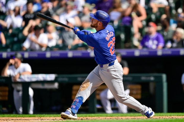 Michael Busch #29 of the Chicago Cubs hits a seventh inning solo home run against the Colorado Rockies at Coors Field on Sept. 15, 2024 in Denver, Colorado. (Photo by Dustin Bradford/Getty Images)