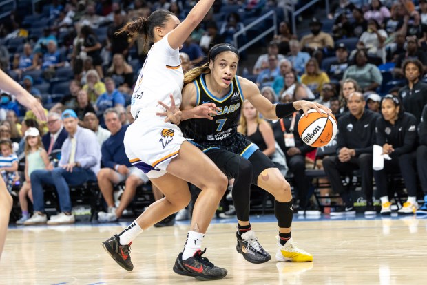 Chennedy Carter #7 of the Chicago Sky drives against Celeste Taylor #12 of the Phoenix Mercury at Wintrust Arena on Sept. 15, 2024 in Chicago, Illinois. NOTE TO USER: User expressly acknowledges and agrees that, by downloading and or using this photograph, User is consenting to the terms and conditions of the Getty Images License Agreement. (Photo by Geoff Stellfox/Getty Images)