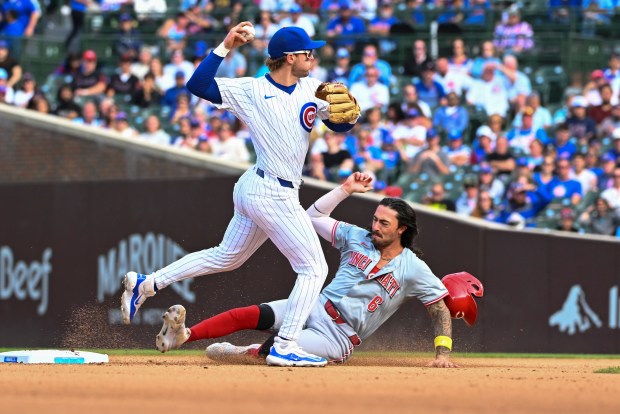 Nico Hoerner #2 of the Chicago Cubs forces out Jonathan India #6 of the Cincinnati Reds on a fielder's choice in the eighth inning at Wrigley Field on Sept. 29, 2024 in Chicago, Illinois. The Reds defeated the Cubs 3-0. (Photo by Nuccio DiNuzzo/Getty Images)